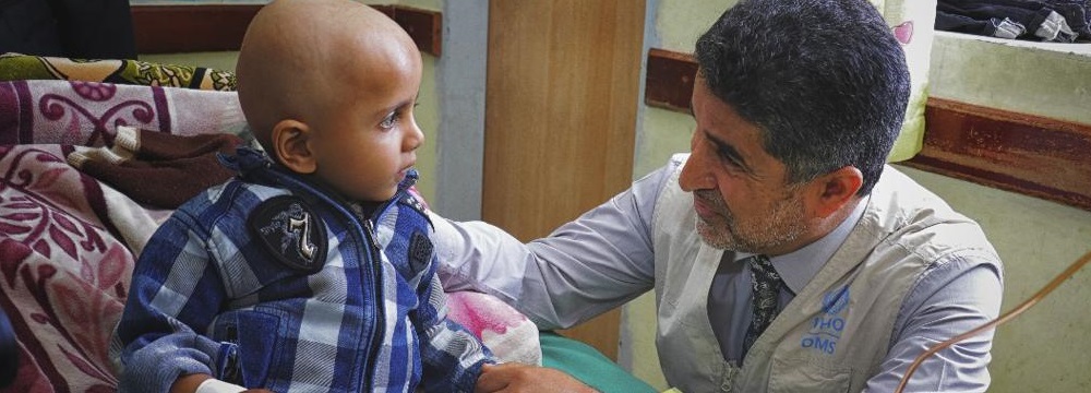 Regional Director visits a child patient in hospital