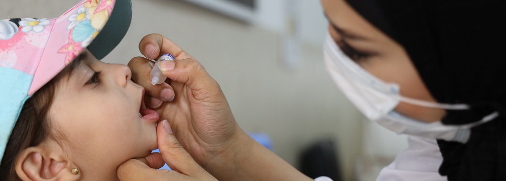 child receives polio vaccine