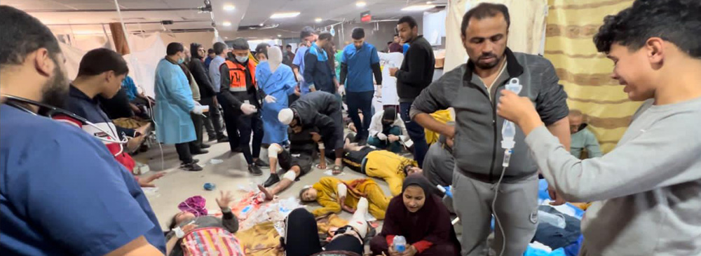 Patients wounded waiting to be treated at Al Shifa hospital