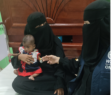 Two women and infant in Yemen