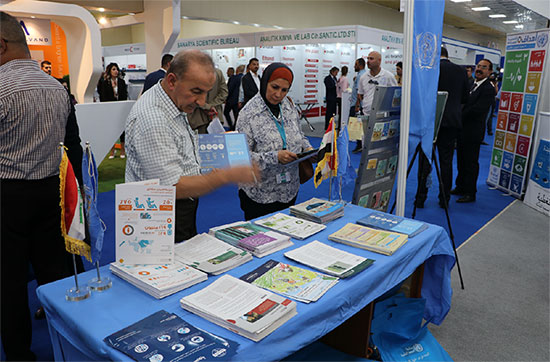  Members of the public chosing information materials at the health Expo in Baghdad Iraq