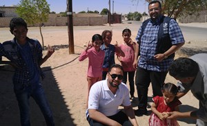 Children_in_Libya_hold_up_their_finger_to_indicate_that_they_have_received_polio_vaccine