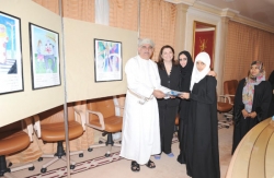 High-level dignatories handing out prizes and letters of appreciation to winners of the WHO 2012 art competition