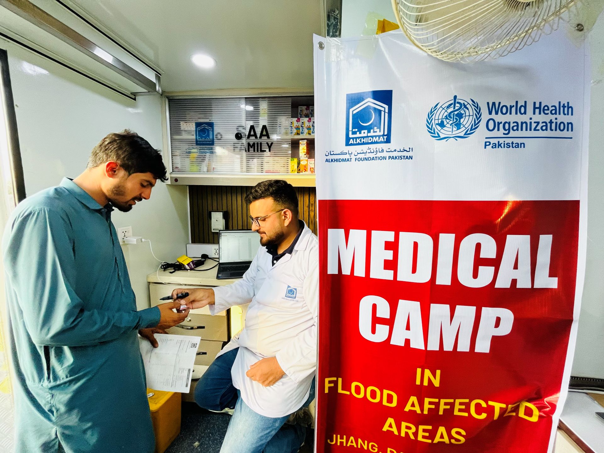 A patient receives prescribed medicines after being checked up in a WHO-supported mobile health unit. Photo credit: WHO Pakistan