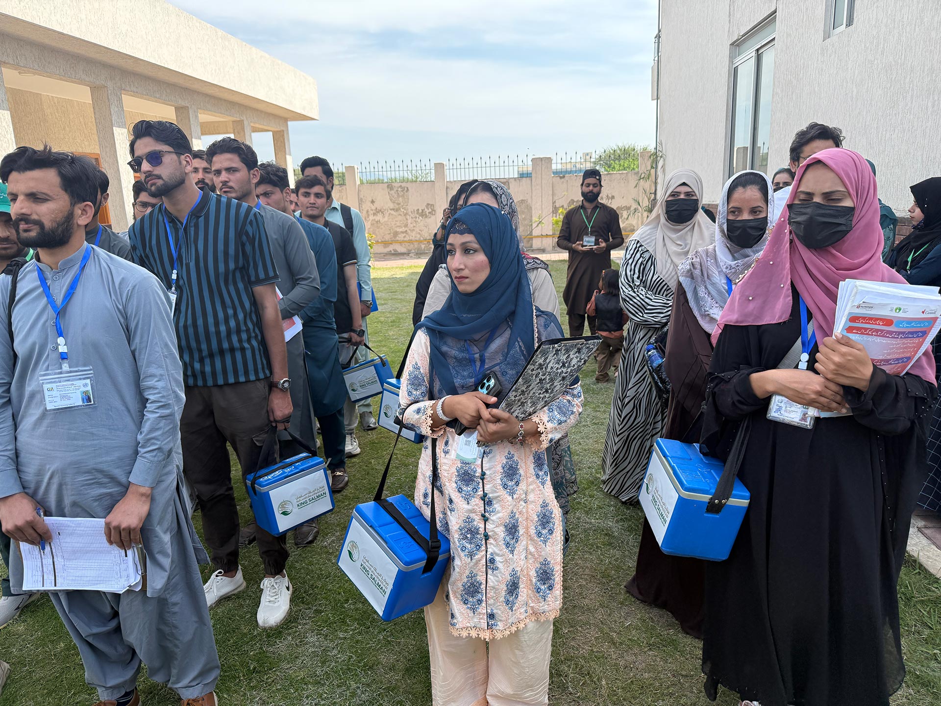 Polio worker Saima (centre) during the morning briefing before departing on a vaccination round in Islamabad, Pakistan, during the April 2026 national polio campaign. Photo credit: Hamid Inam/WHO Pakistan