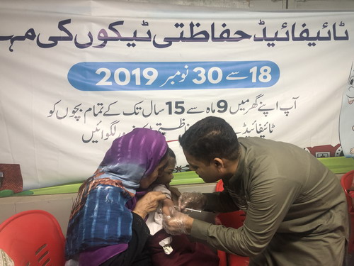 A_child_receiving_typhoid_vaccination_in_Sindh