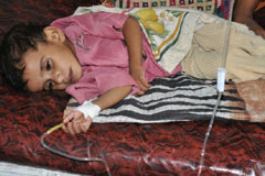 A child receives a drip in a civil hospital in Sanghar, Sindh