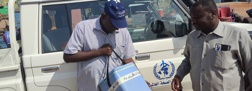 Dr Abdellatif Abdelwahab, Public Health Officer of White Nile State (left), collecting stool samples from Sennar State on his way to Gezira State