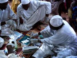 Sudanese community volunteers receiving training on malaria rapid diagnostic tests
