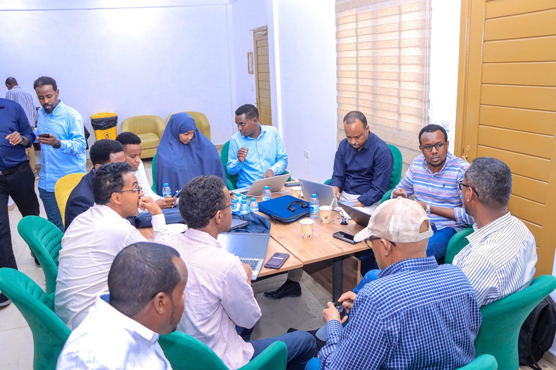  Field teams from national and state levels engage in discussions, exchanging insights and perspectives during the meeting. Photo credit: Abdirahim Aweis, WHO/Somalia