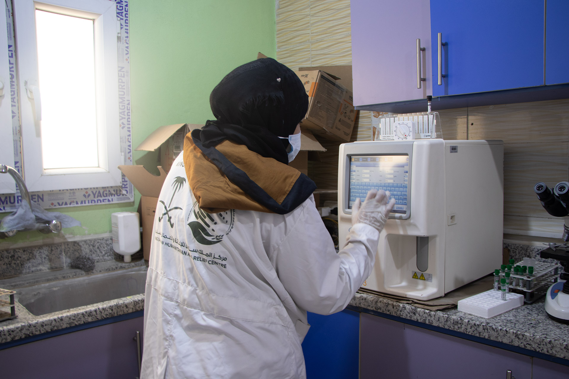 Maryam reviews laboratory results at Al-Bab Health Centre. Photo credit: WHO
