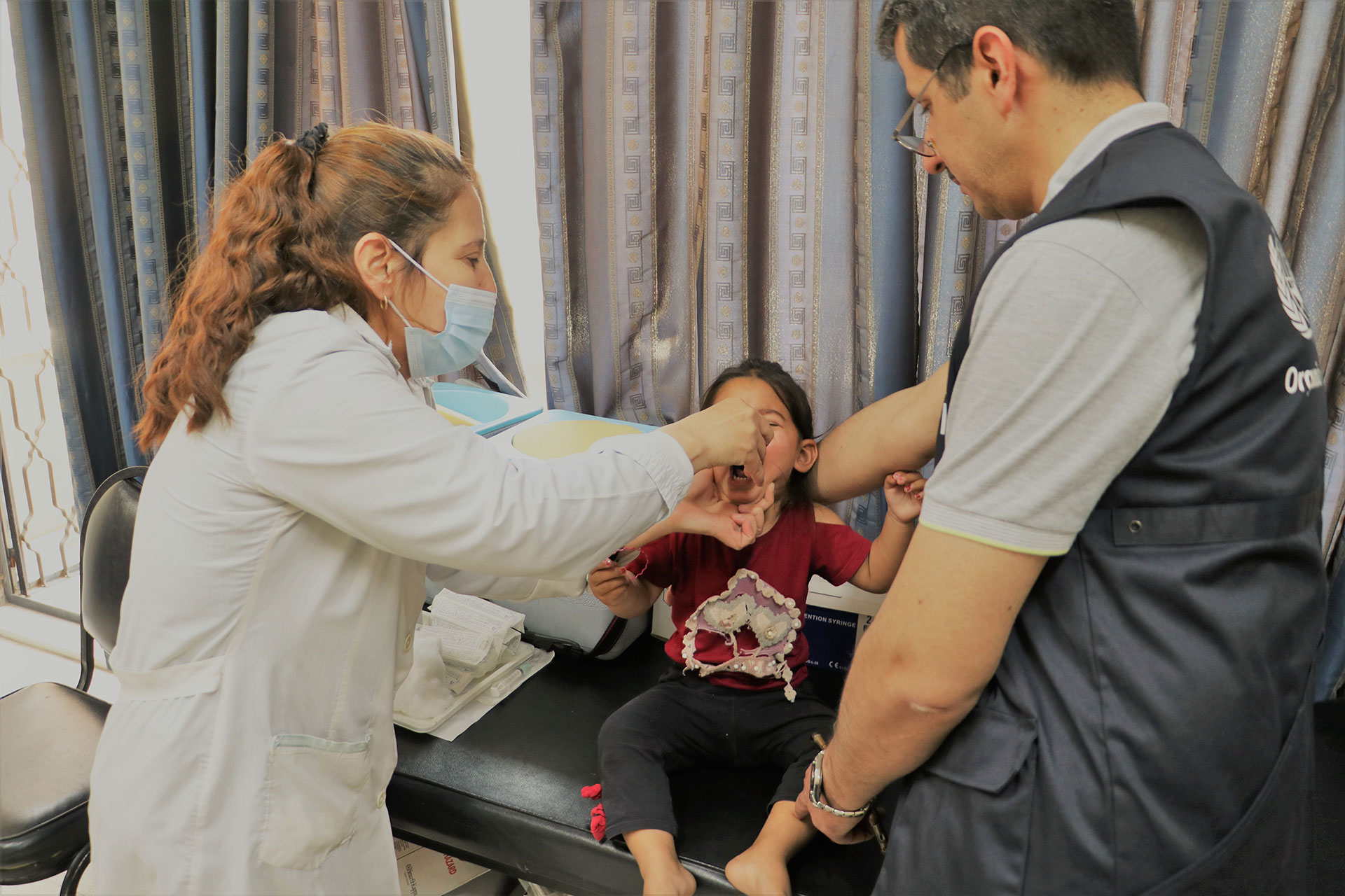Child receiving polio vaccination at a health center in Daraa during the Big Catch-Up vaccination campaign conducted across Syria 