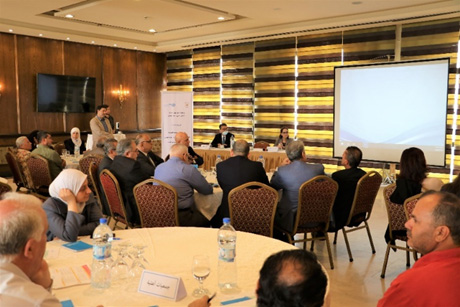 Representatives of the Syrian Ministry of Health and WHO discuss the National Multi-Sectoral Action Plan for prevention and control of NCDs. Photo credit: WHO Syria