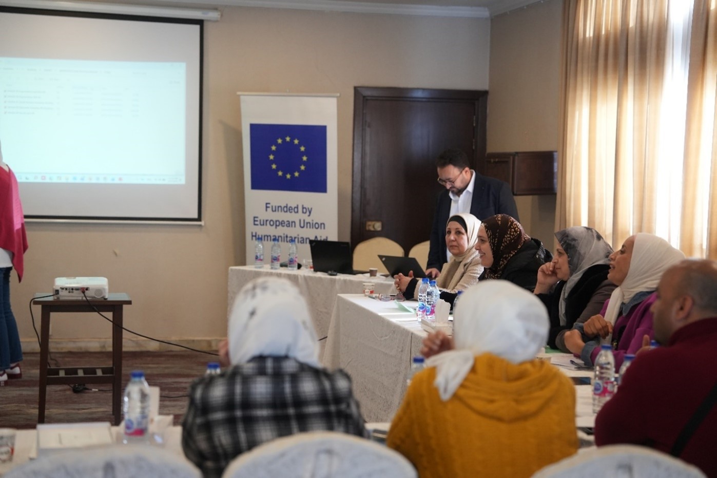 Participants and trainers review standardized methodologies to be applied during the nationwide malnutrition survey. Photo credit: WHO