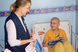 Hamad receives a gift package from WHO on World Cancer Day. Hamad has to come to the hospital for 5 days every 3 months to be treated for leukemia