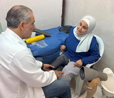 Jehan receiving free maintenance for her artificial limbs at the Rehabilitation and Artificial Limbs Centre