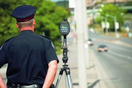 Police officer with speed camera