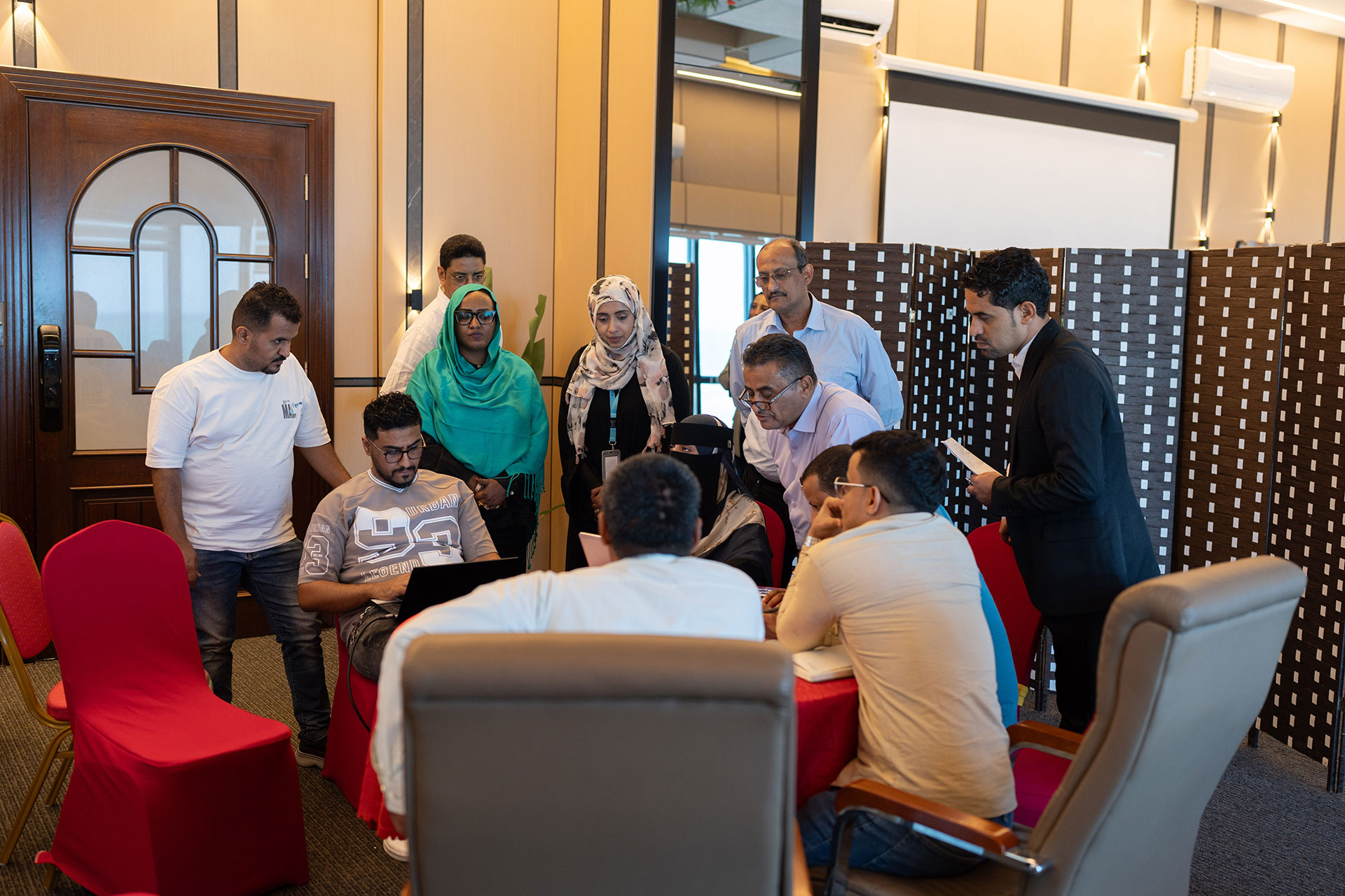 Participants collaborate during a WHO-supported PHEOC training in Aden, strengthening coordination and decision-making for effective emergency response.